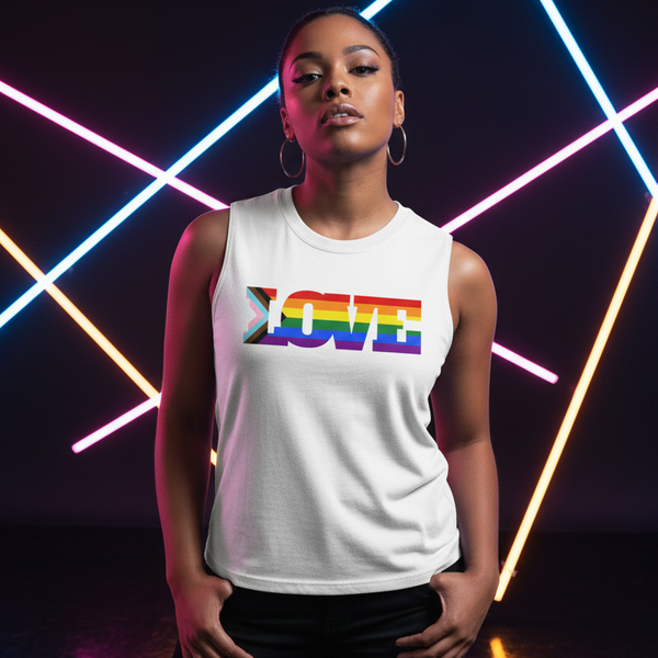White relaxed-fit muscle tee with bold rainbow “LOVE” text, Progress LGBT pride style; person, hoop earrings, neon backdrop