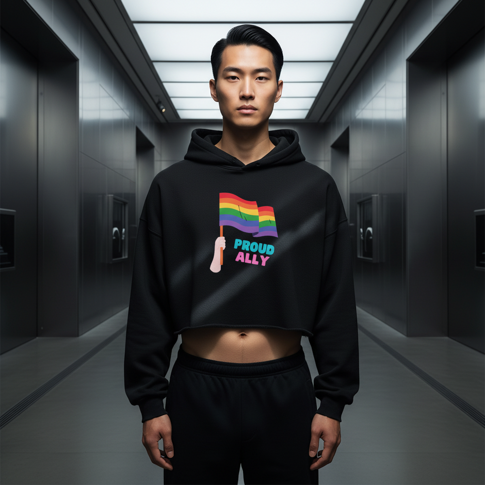 Proud Ally Crop Hoodie with rainbow flag and “Proud Ally” text, worn by a young man in black pants; queer vibe, serious look.