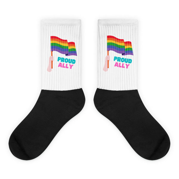 Pair of white-and-black ribbed socks with rainbow flags and “PROUD ALLY” text