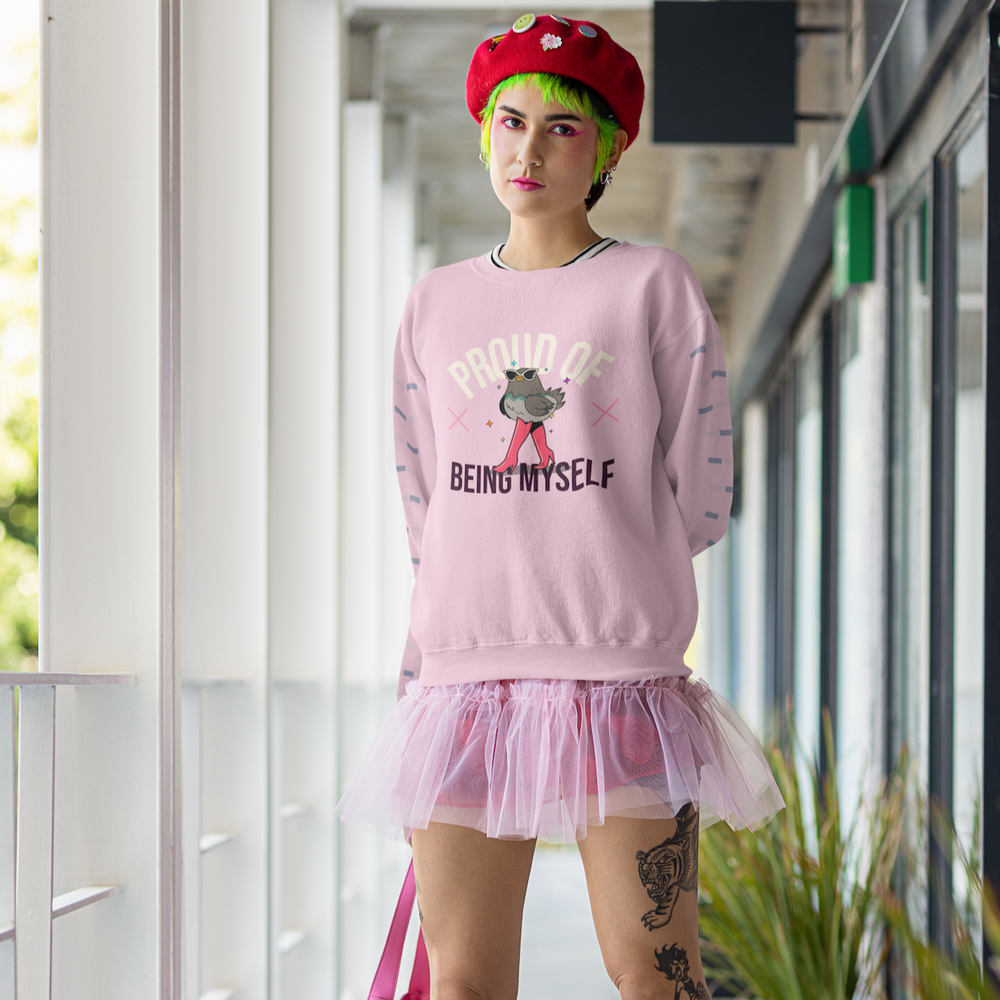 Front view of a person in a pink sweatshirt reading “PROUD OF BEING MYSELF,” with a cartoon pigeon