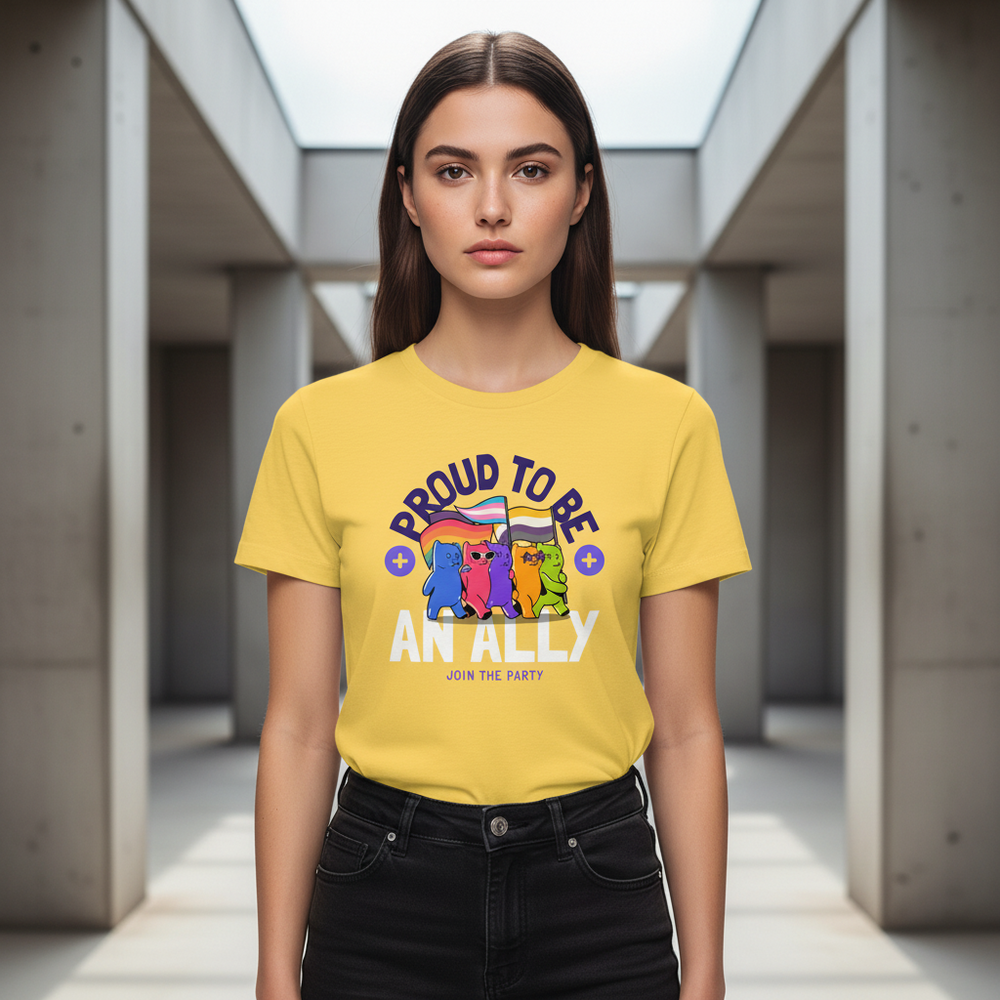 Proud To Be An Ally T-Shirt with bold cartoon animals and pride flags, modeled by a young woman in sunlight-filled corridor.
