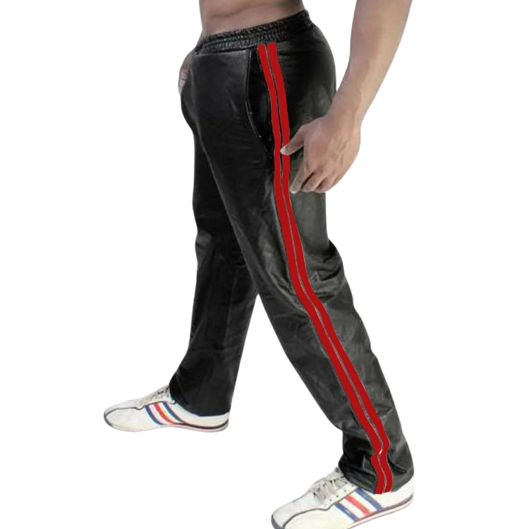 Side view of a model wearing black faux-leather pants with twin red side stripes and white sneakers