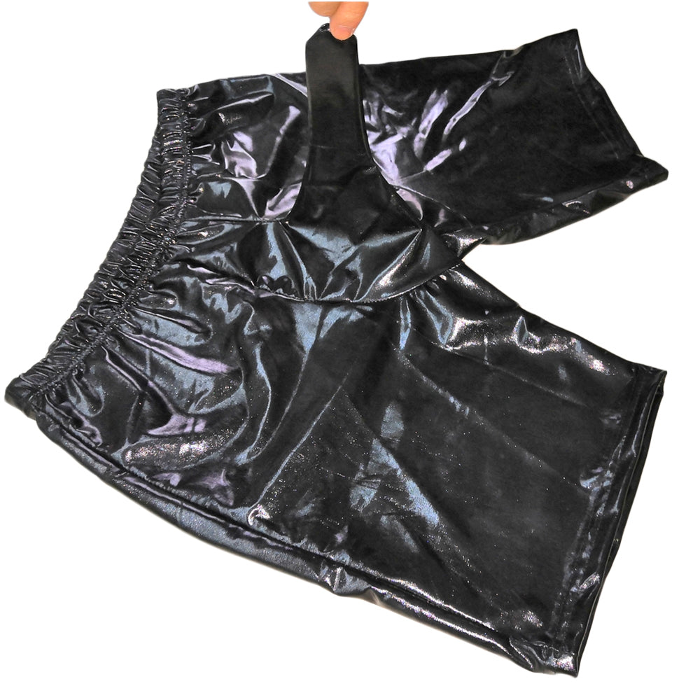 Black shiny fetish shorts held up by a hand, with a long elephant-trunk front panel