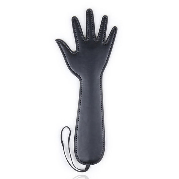 Black hand-shaped faux-leather flog laid flat on a white background