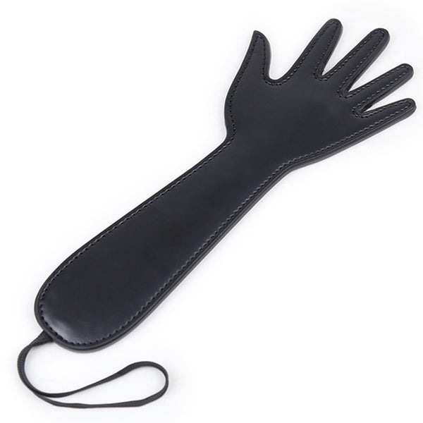 Black faux-leather hand-shaped flog with stitched edges and wrist loop, shown on white