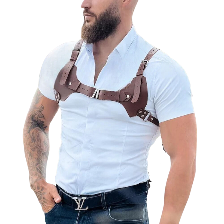 Close-up of a man wearing a brown faux-leather chest harness over a white shirt