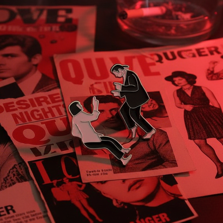 Two retro black-and-white queer-themed enamel pins on vintage pulp magazine pages