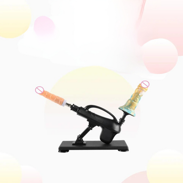 Black automatic sex machine with two angled flesh-toned attachments on a base