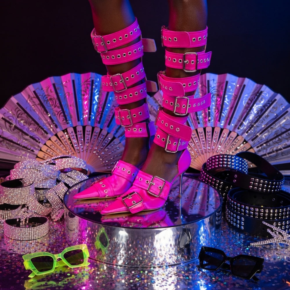 Punk Perfection pink knee-high heeled boots with hot pink buckles, studded belts, neon green-black shades, silver fans
