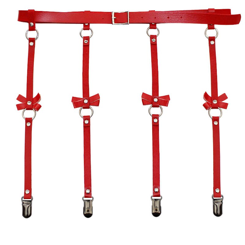 Flat-lay of a red punk garter belt with four dangling straps, bows, rings, and clips