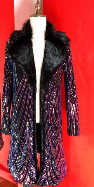 Long purple sequined coat with a black faux-fur collar on a mannequin