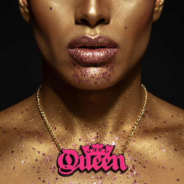 Queen acrylic statement chain necklace worn against a glitter-covered chest