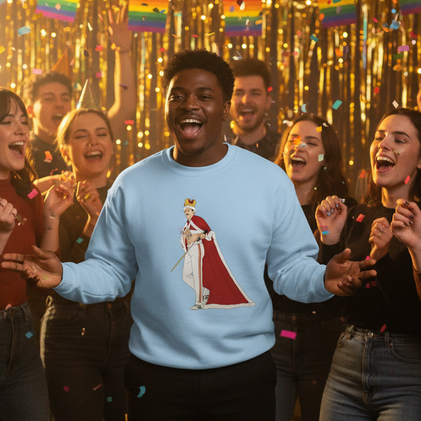 Person wearing a light blue sweatshirt with a crowned, caped figure graphic at a festive party