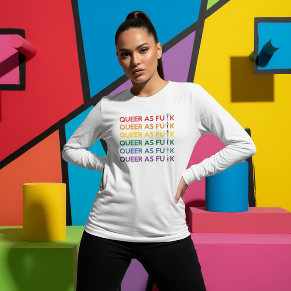Queer As Fu#k Unisex Long Sleeve T-Shirt with bold rainbow text, worn by a confident person