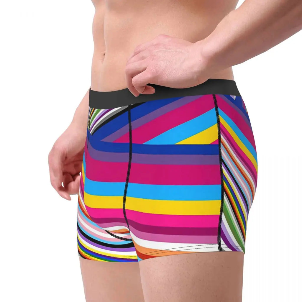 Side view of a model wearing colorful striped boxer briefs with a black waistband