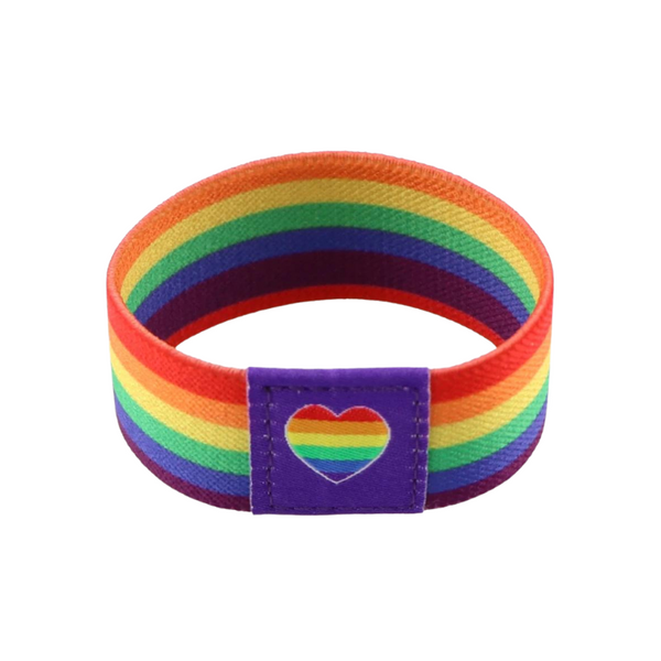 Rainbow-striped wristband with a purple patch featuring a rainbow heart