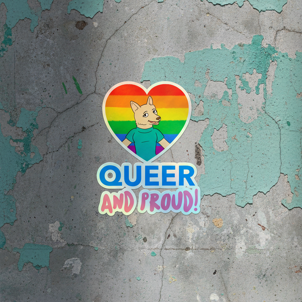 Holographic sticker shaped like a rainbow heart, with a cartoon dog in a blue shirt on a rainbow flag and “QUEER” in blue