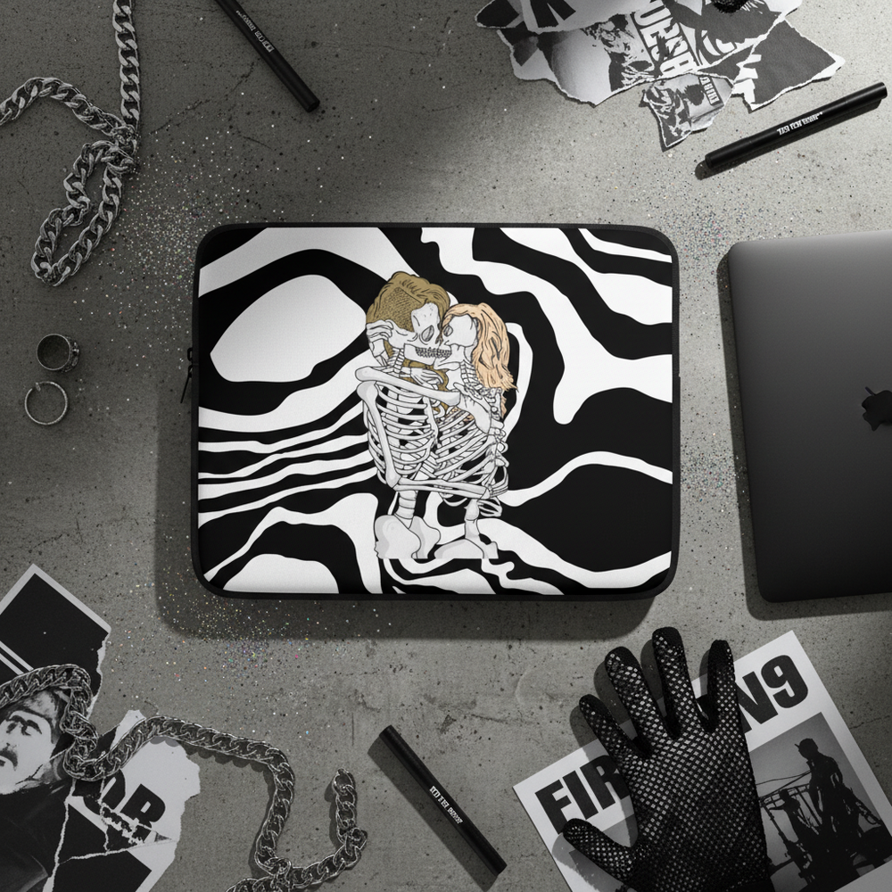 Queer Skeletons Laptop Sleeve shows two folks hugging over swirling stripes, laid on gray with chain, rings, pens, glove