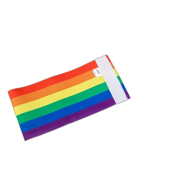 Angled flat lay of a rainbow-striped chest binder with a white side panel