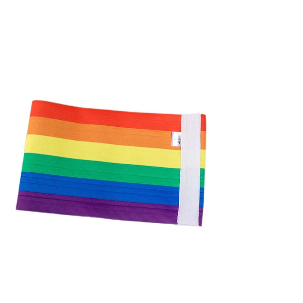 Flat-lay rainbow-striped chest binder with a wide white side panel on a white background