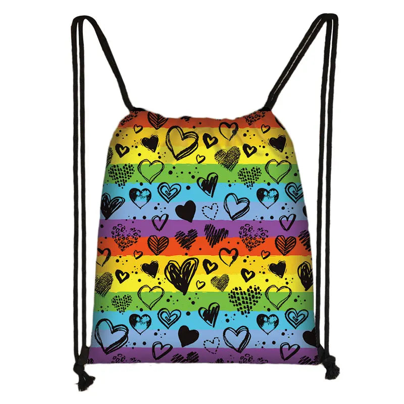 Rainbow-striped drawstring bag covered in hand-drawn hearts and doodles