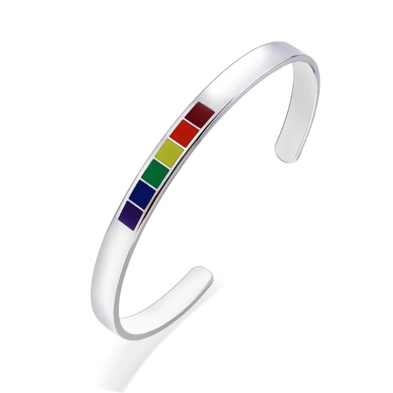 Silver open bangle with six rainbow-colored rectangular accents, shown at an angle