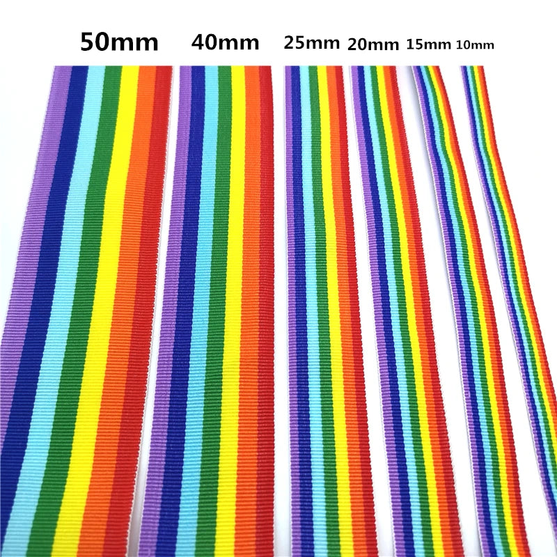 Close-up of six rainbow-striped craft ribbons labeled 50mm to 10mm wide