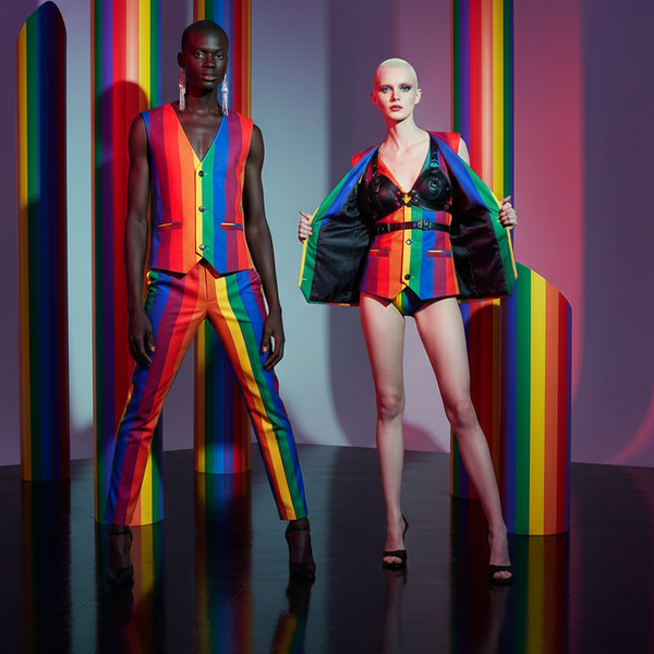 Two models pose in rainbow-striped vests; the right model opens a black-lined jacket to show a deep V neckline.