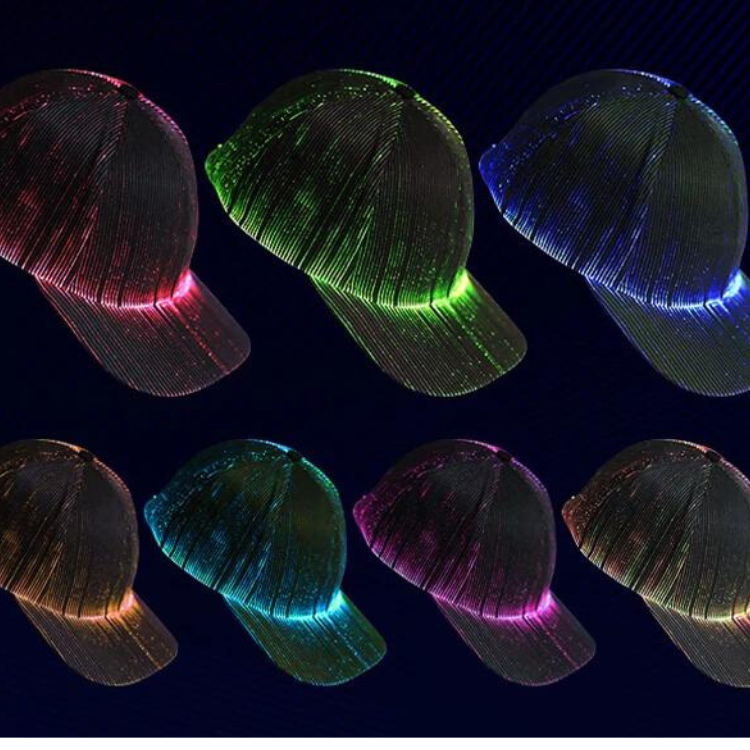 Six black LED fiber-optic baseball caps glowing in pink, green, blue, cyan, and amber