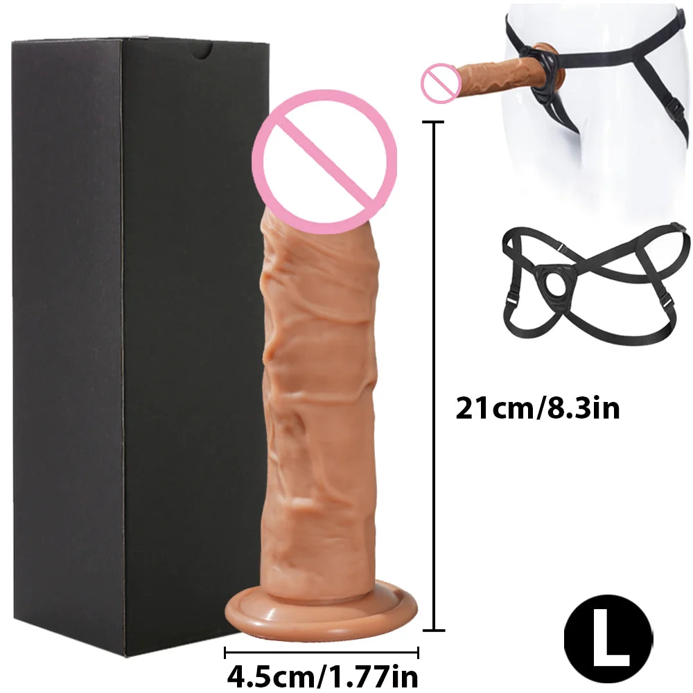 Flesh-toned realistic dildo beside a black harness, shown with size measurements and L label