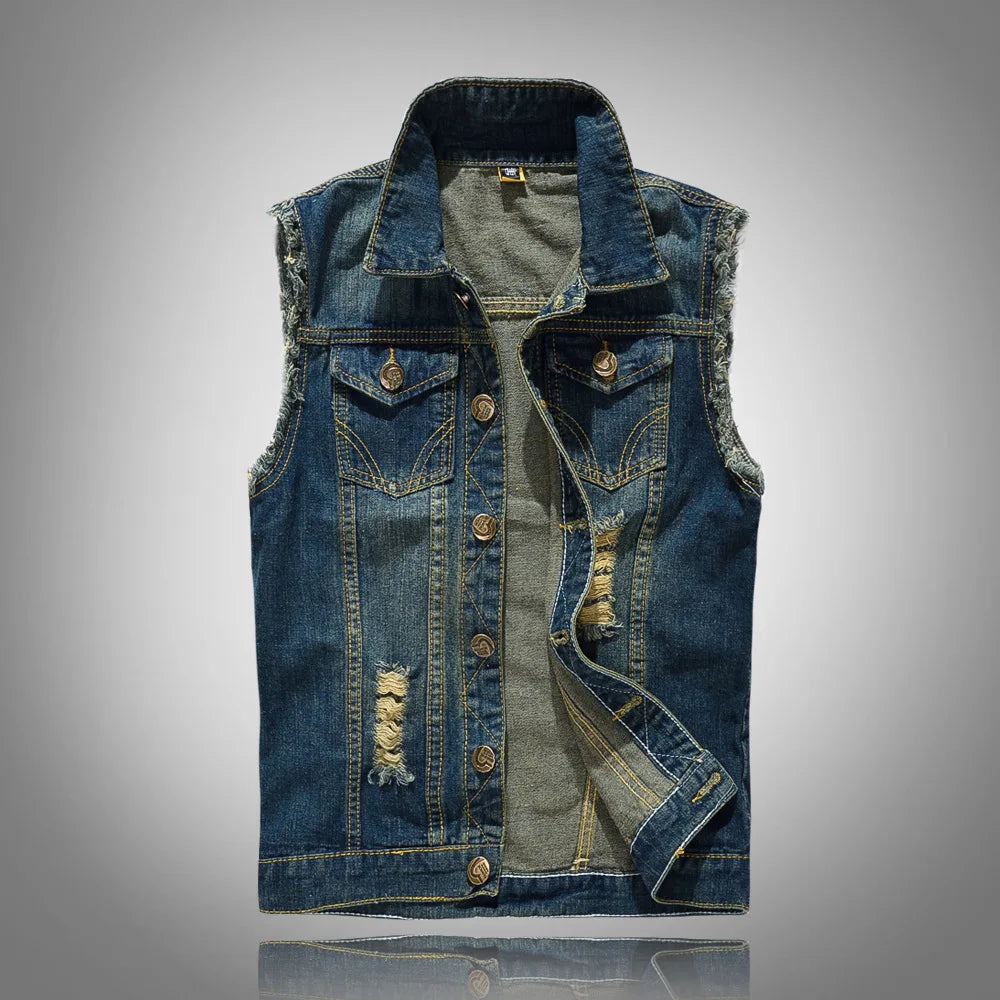 Front view of a sleeveless dark blue denim vest with frayed edges and distressed patches