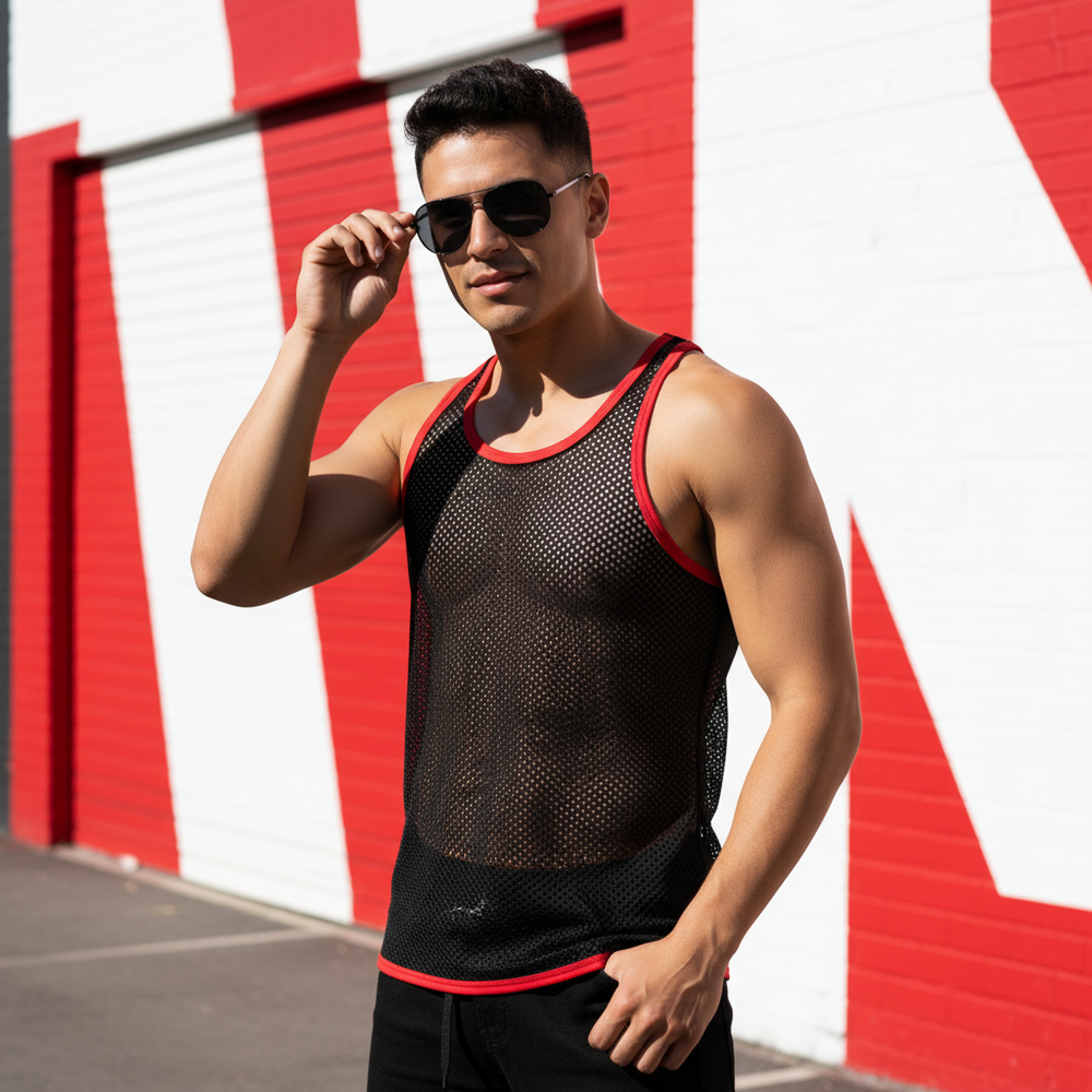 Model wearing a black mesh muscle tank with red trim outdoors