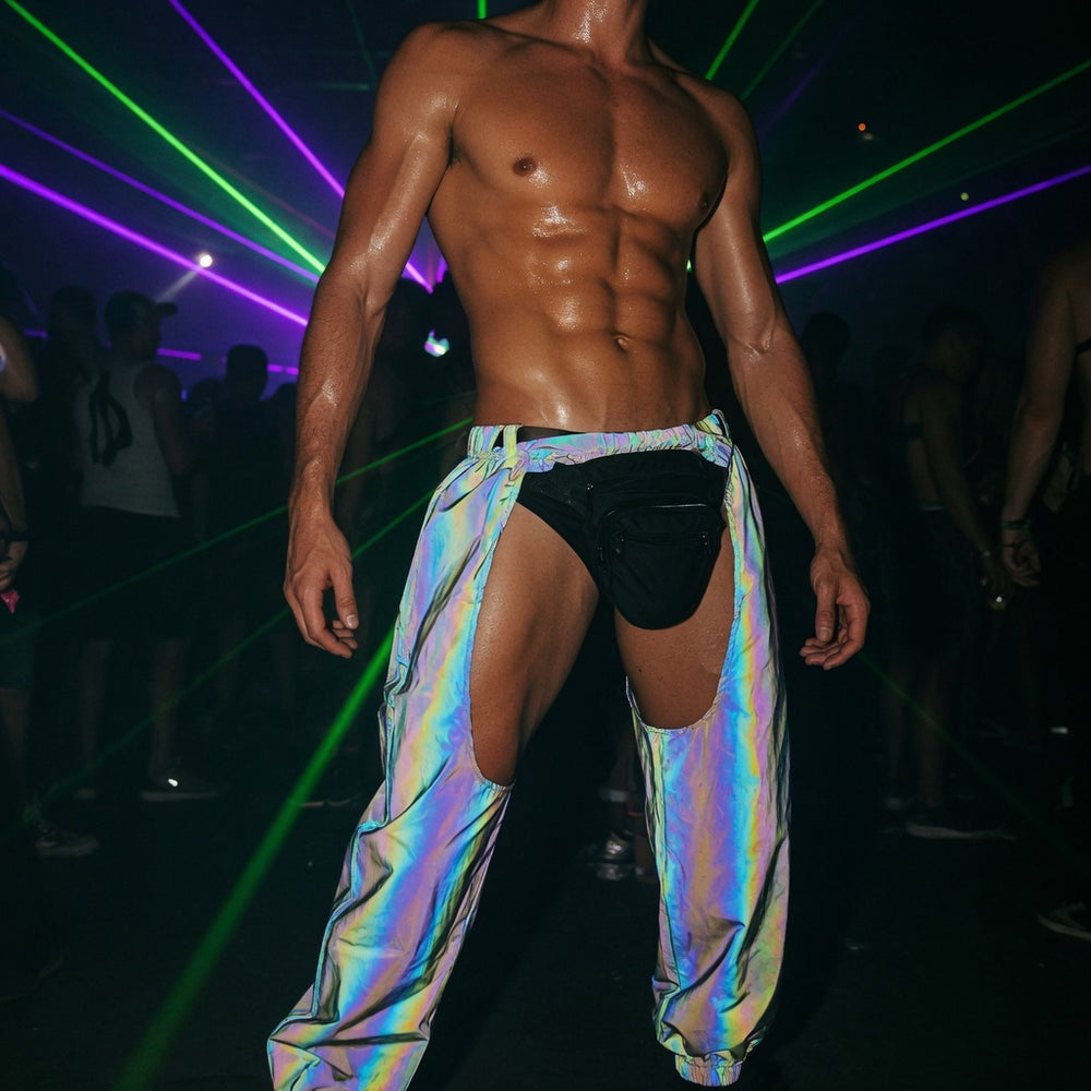 Shirtless model wearing iridescent cutout cargo pants at a laser-lit rave