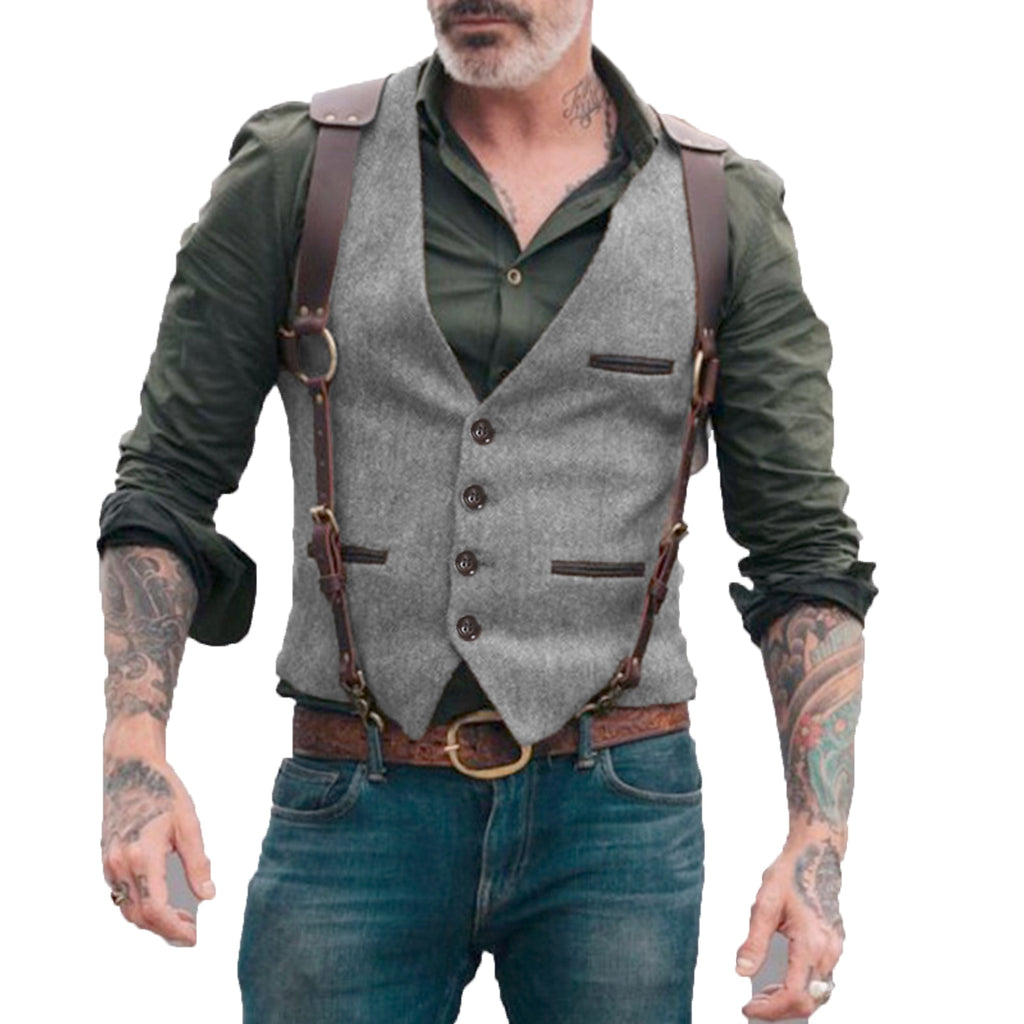 Front view of a person wearing a gray button-front vest with dark trim and leather harness straps