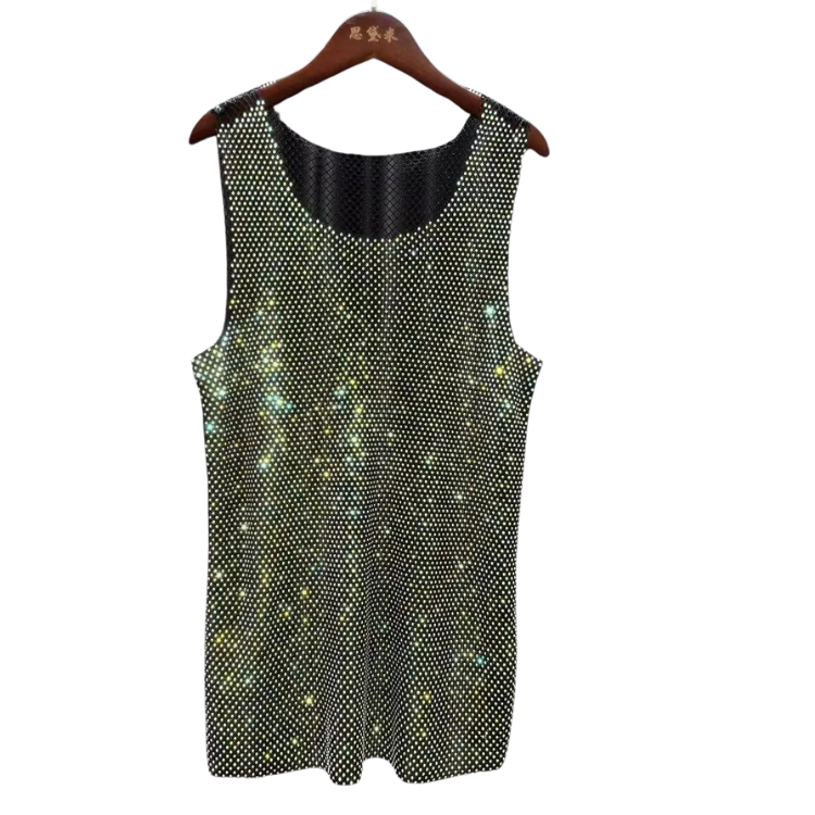 The Rhinestone Rhapsody Mesh Tank Top, shimmering with reflective dots, hangs on a wooden hanger