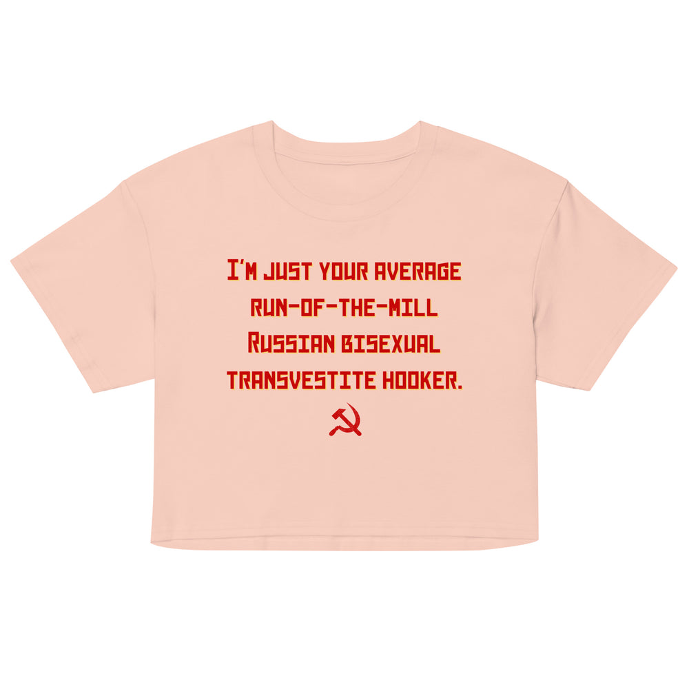 Front view of a peach crop top with red text and a hammer-and-sickle symbol