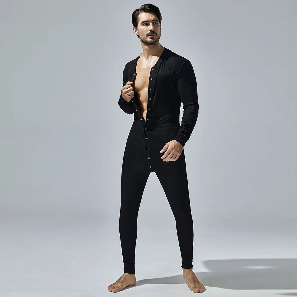 Front-view model wearing a black long-sleeve button-front pajama romper