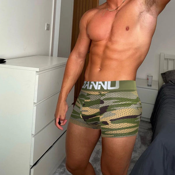 Model wearing green camouflage mesh boxer briefs with a wide ADANNU waistband