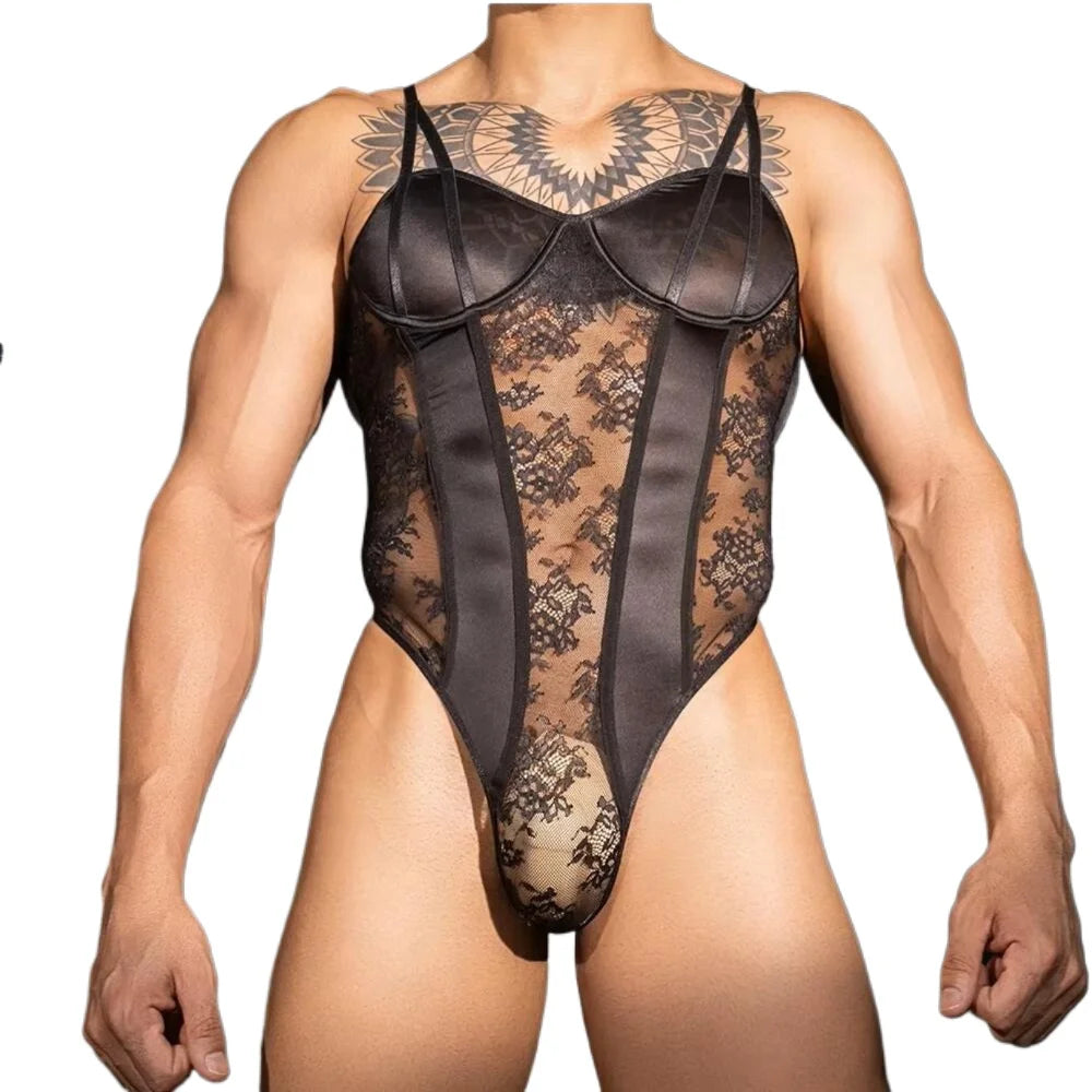 Front view of a muscular model wearing a black lace and satin-panel mesh bodysuit