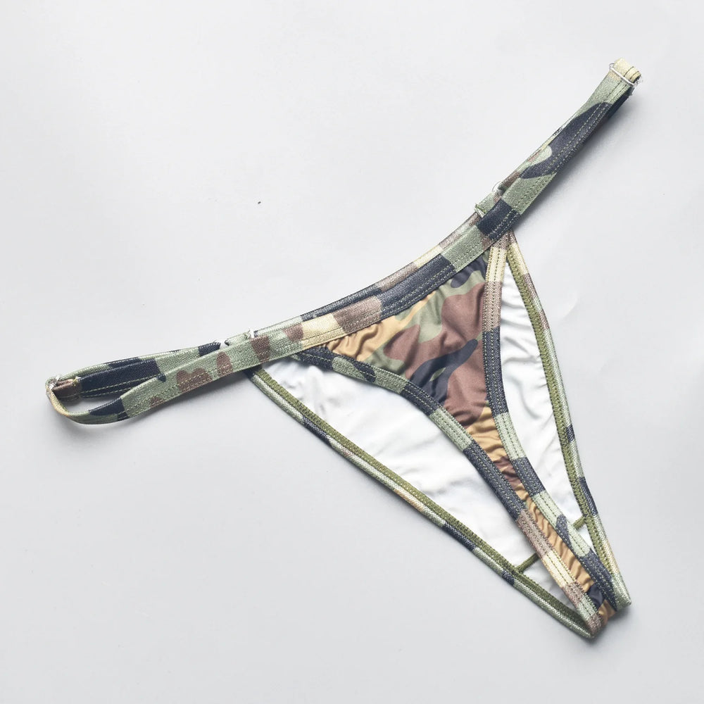 Flat lay close-up of a camouflage thong with narrow straps and a minimal pouch