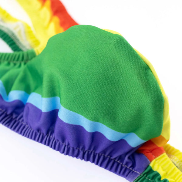 Close-up of rainbow-striped thong mankini fabric and elastic waistband