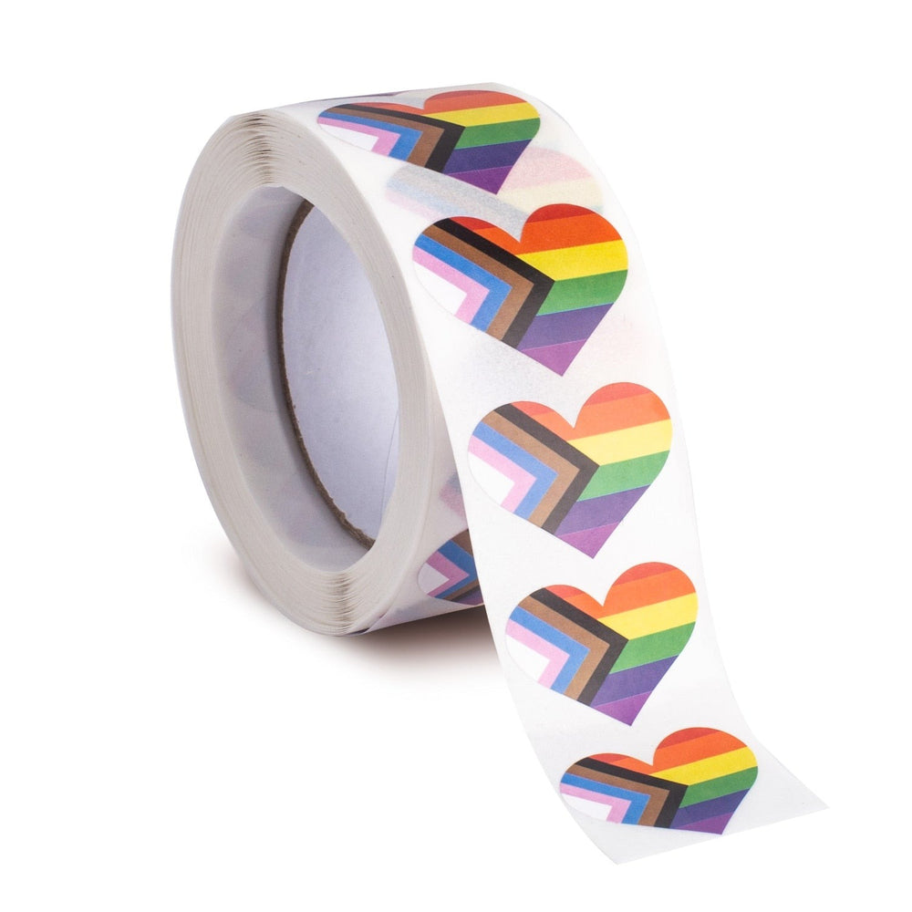 Roll of Progress Pride heart stickers, with a strip unrolled to show several stickers