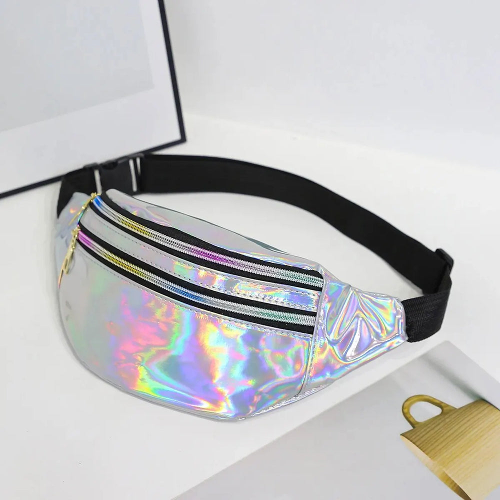 Close-up of an iridescent holographic fanny pack with black strap and two front zippered pockets