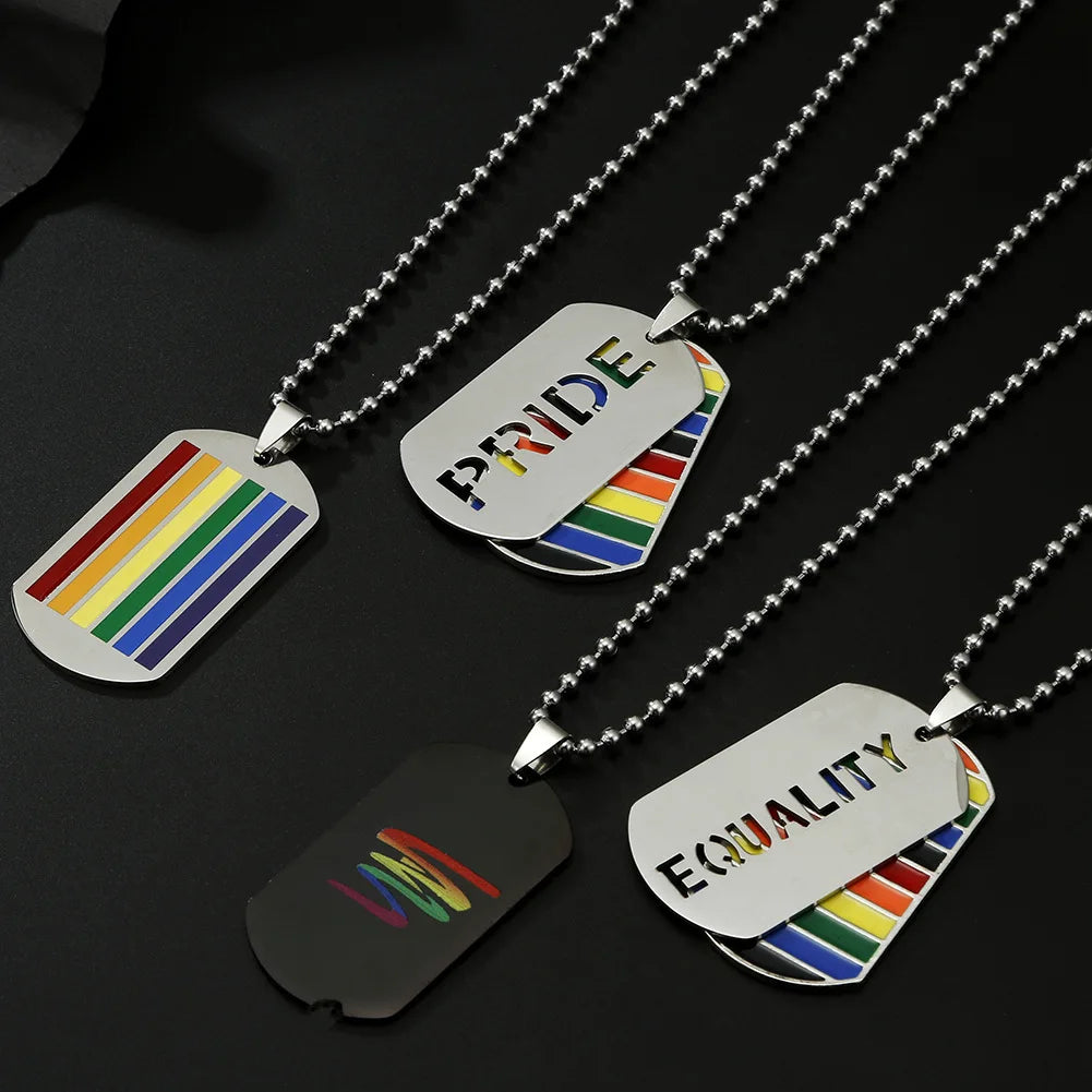 Three silver-tone dog tag necklaces with rainbow stripes and PRIDE and EQUALITY designs