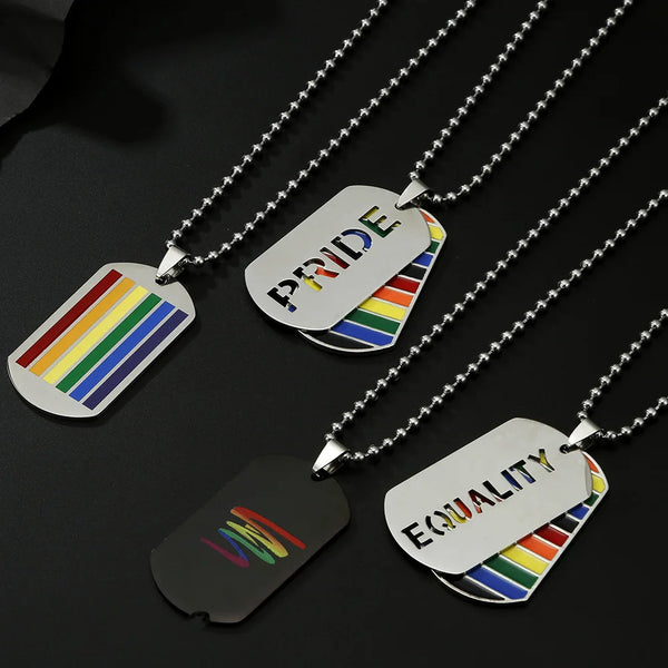 Three silver-tone dog tag necklaces with rainbow stripes and PRIDE and EQUALITY designs