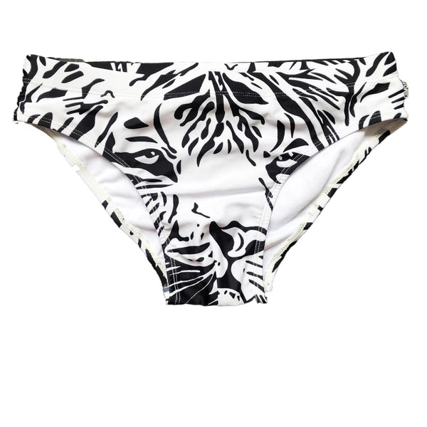 Front view of a white swim brief with bold black zebra-stripe animal print