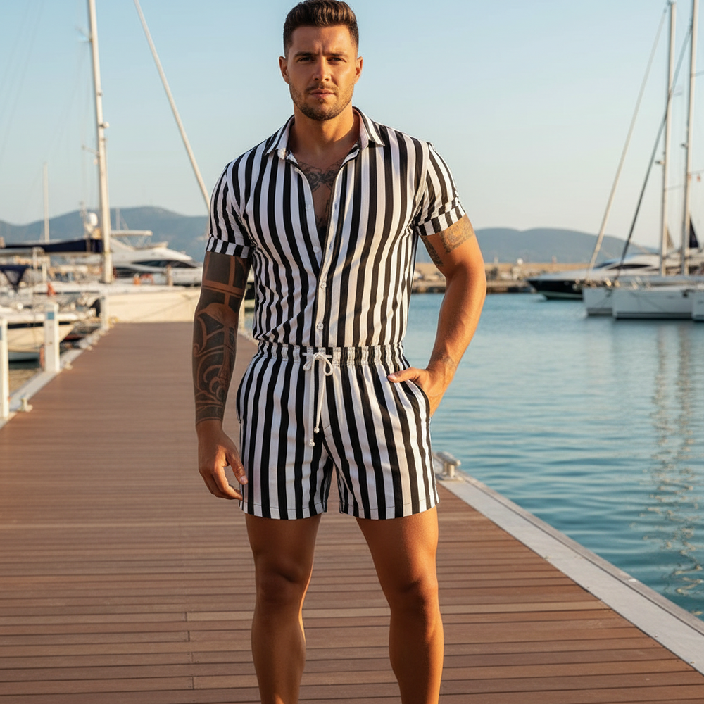 Sailor Striped Romper on a tattooed, muscular person at a sunlit marina, yachts and calm water behind