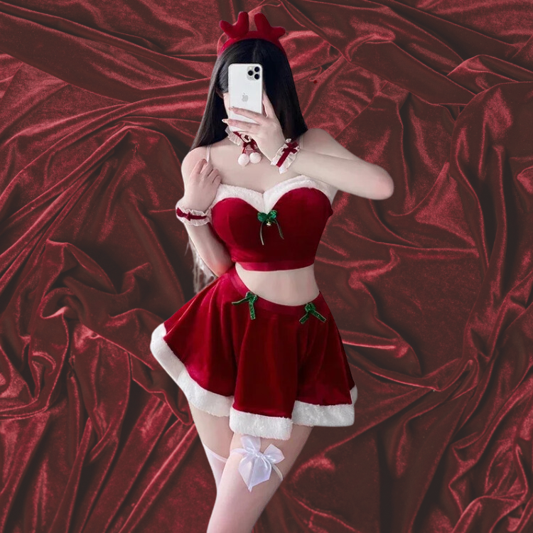Front-facing person models a red velvet Santa costume with white trim and thigh-high stockings