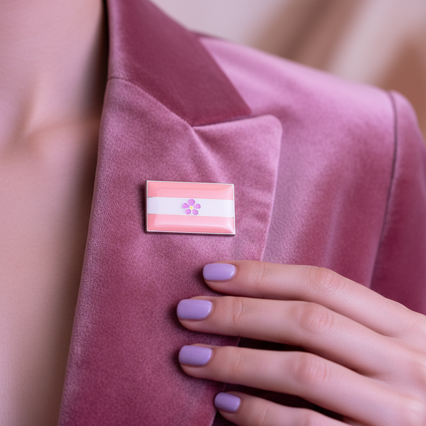 Rectangular pink-and-white striped enamel pin with a purple flower on a pink blazer