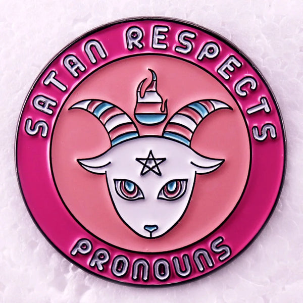 “Satan Respects Pronouns” enamel pin with a striped-horned goat design